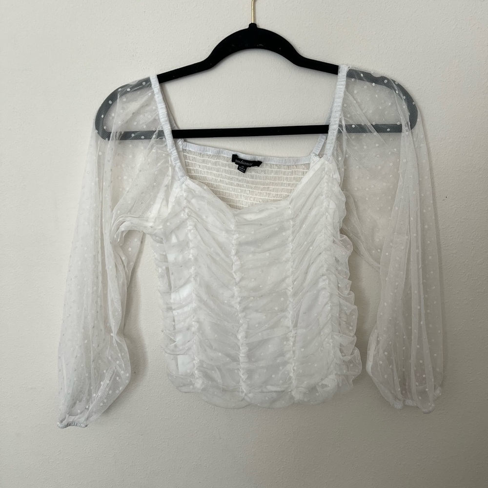 Women’s top with sheer sleeves
